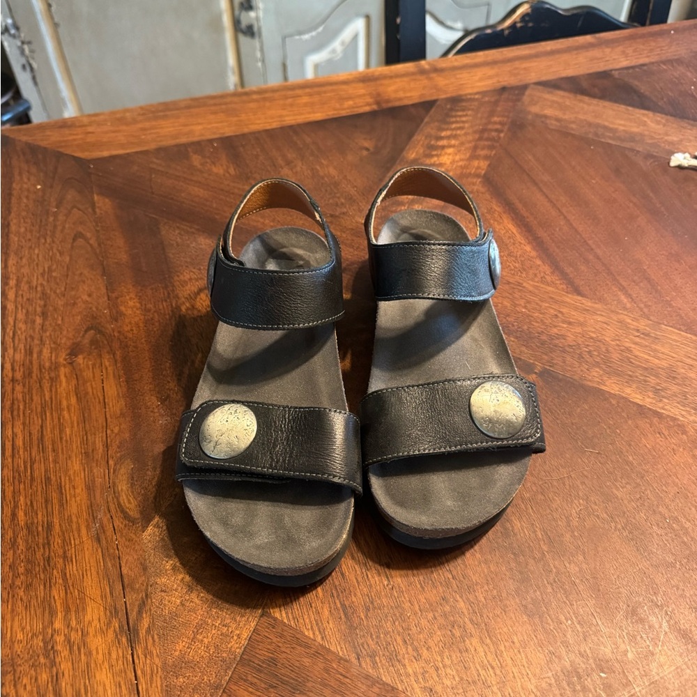 Taos Footwear Black Leather Two-Strap Sandals with Silver Medallions